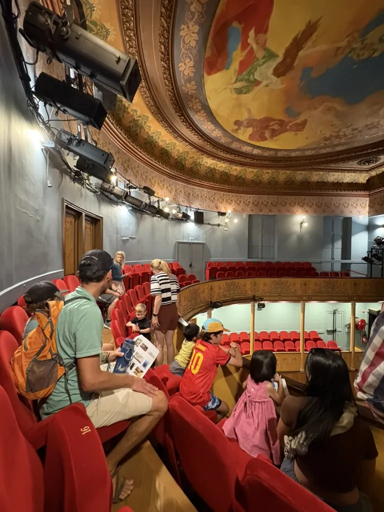 Exploring red velvet seats, painted ceilings and the town’s theatre together.